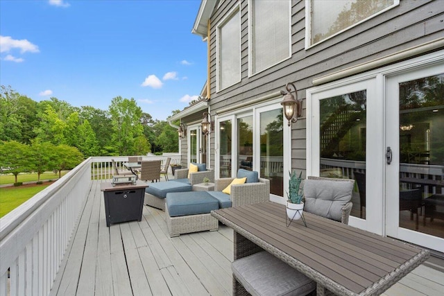 deck featuring outdoor dining area