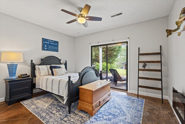 bedroom featuring access to outside, a textured ceiling, baseboards, and ceiling fan