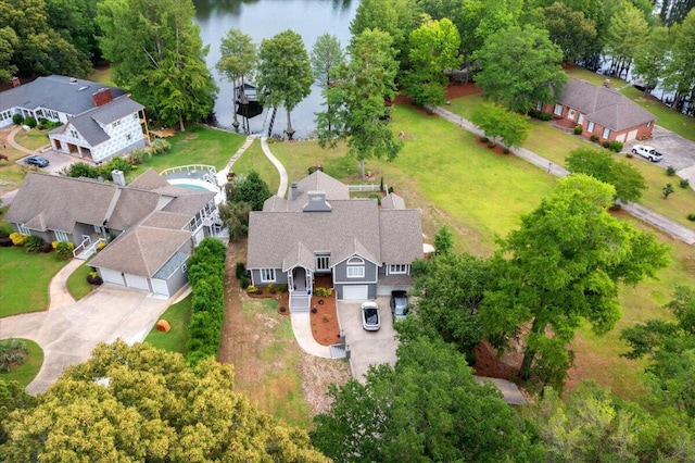 aerial view of property and surrounding area with a nearby body of water