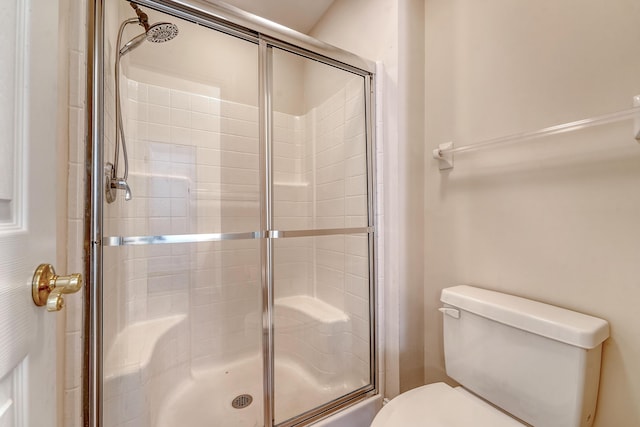 9117 Woodcreek Ct, North Charleston, SC 29406 - bathroom with a tile shower and toilet