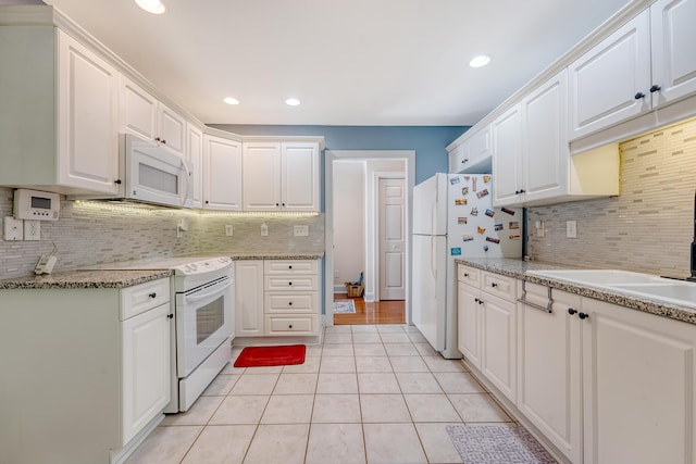 9117 Woodcreek Ct, North Charleston, SC 29406 - kitchen featuring white appliances, backsplash, white cabinets, and recessed lighting