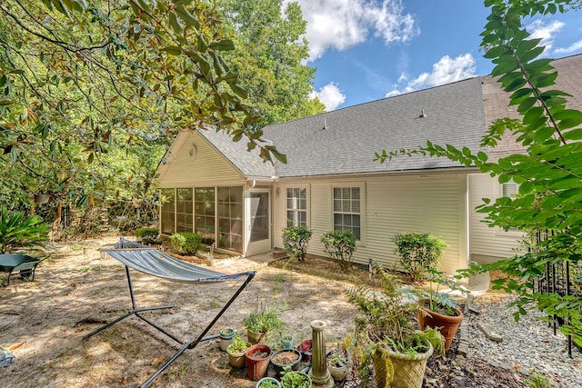 9117 Woodcreek Ct, North Charleston, SC 29406 - rear view of house with a sunroom and roof with shingles
