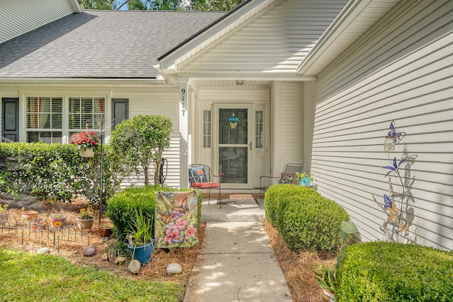 9117 Woodcreek Ct, North Charleston, SC 29406 - property entrance with roof with shingles and covered porch