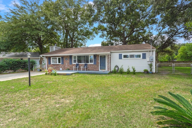 ranch-style home with a front lawn