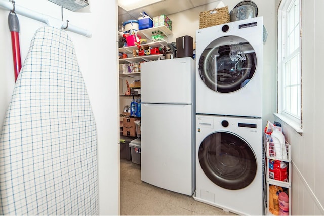 laundry area featuring stacked washer and dryer