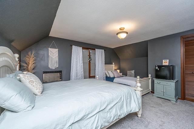 carpeted bedroom featuring lofted ceiling, a wall mounted air conditioner, and a textured ceiling