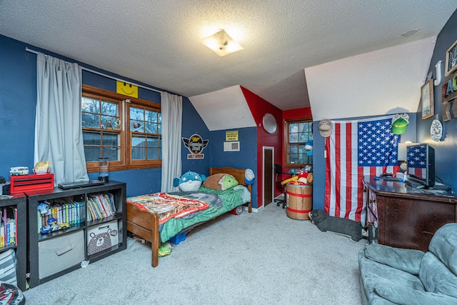 carpeted bedroom with multiple windows, a textured ceiling, and lofted ceiling