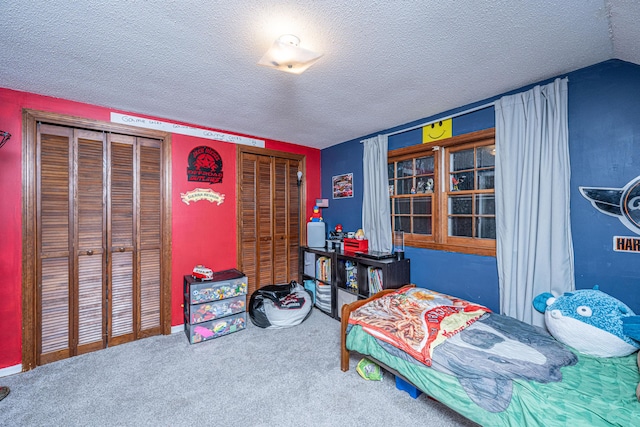 carpeted bedroom with a textured ceiling