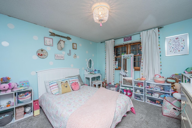 carpeted bedroom with a textured ceiling