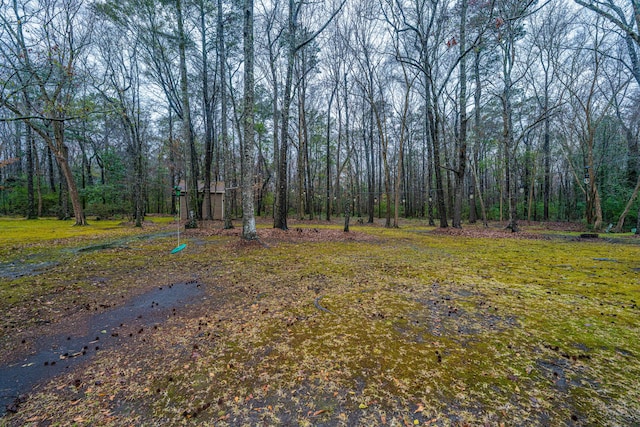 view of yard featuring a view of trees