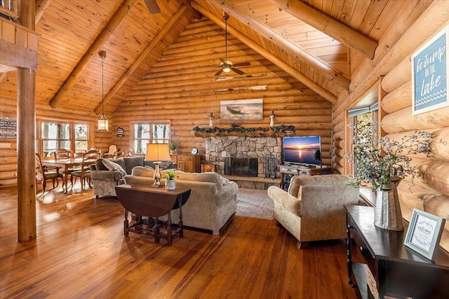 3550 Princess Pond Rd, Summerton, SC 29148 - living room featuring rustic walls, a ceiling fan, wood ceiling with exposed beams, high vaulted ceiling, and healthy amount of natural light