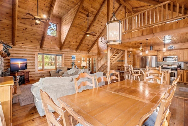 3550 Princess Pond Rd, Summerton, SC 29148 - dining room featuring wooden ceiling with exposed beams, high vaulted ceiling, a ceiling fan, light wood-type flooring, and stairway