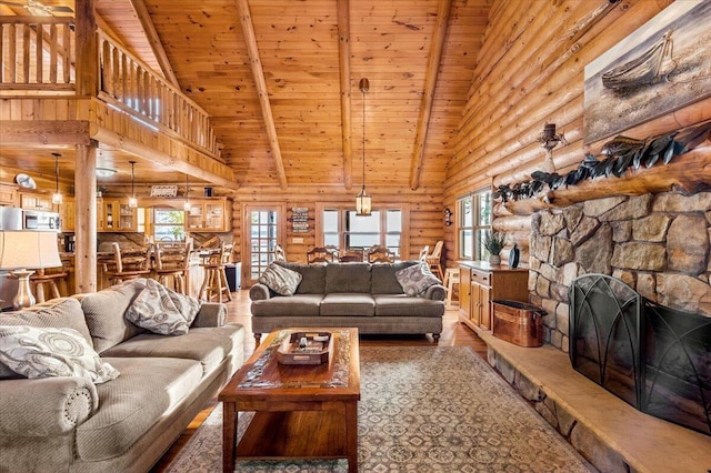 3550 Princess Pond Rd, Summerton, SC 29148 - living room with rustic walls, wood ceiling with exposed beams, high vaulted ceiling, wood finished floors, and a stone fireplace