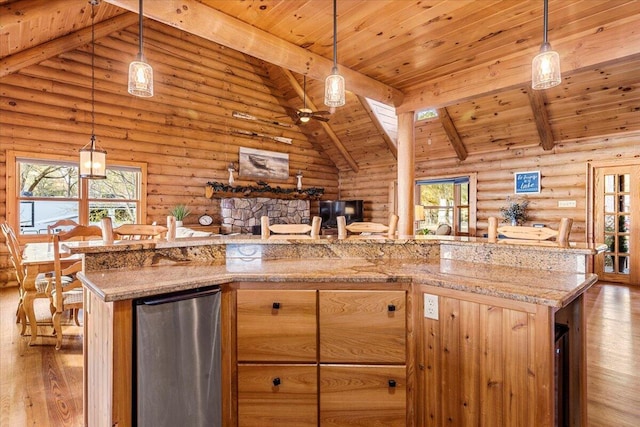 3550 Princess Pond Rd, Summerton, SC 29148 - kitchen featuring wood finished floors, wooden ceiling, open floor plan, rustic walls, and plenty of natural light