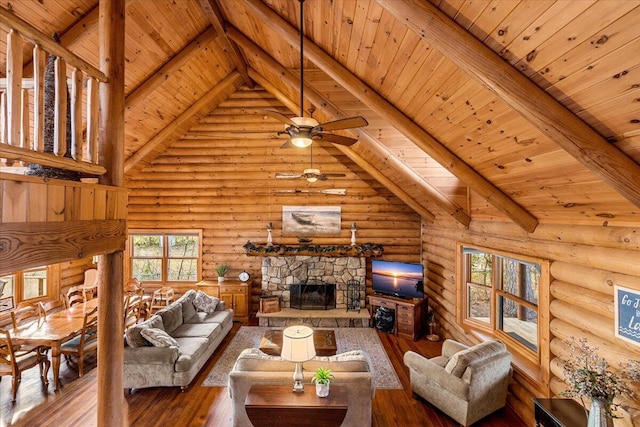 3550 Princess Pond Rd, Summerton, SC 29148 - living room featuring wooden ceiling, rustic walls, hardwood / wood-style flooring, ceiling fan, and a fireplace
