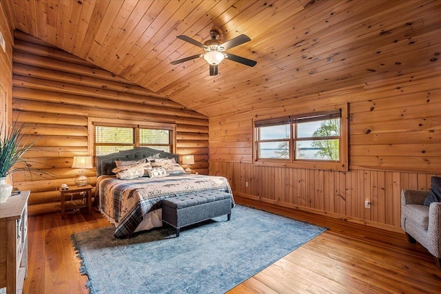 3550 Princess Pond Rd, Summerton, SC 29148 - bedroom with lofted ceiling, multiple windows, wooden ceiling, hardwood / wood-style flooring, and log walls