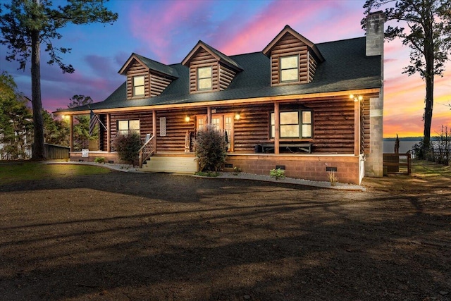 3550 Princess Pond Rd, Summerton, SC 29148 - log home with covered porch, a chimney, and log siding