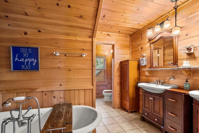 3550 Princess Pond Rd, Summerton, SC 29148 - bathroom with vanity, wooden walls, tile patterned flooring, wooden ceiling, and toilet