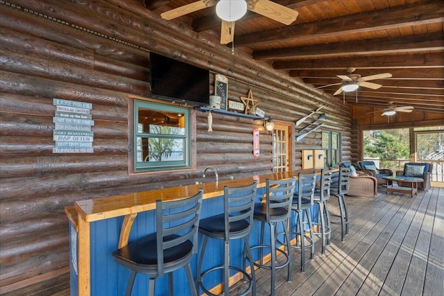 3550 Princess Pond Rd, Summerton, SC 29148 - indoor bar with wooden ceiling with exposed beams, ceiling fan, dark wood-style floors, and log walls