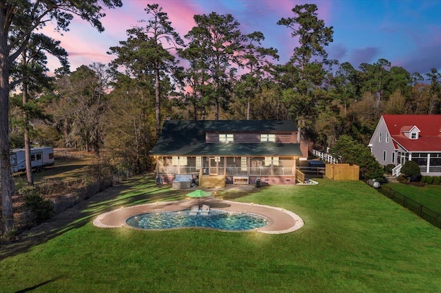 3550 Princess Pond Rd, Summerton, SC 29148 - back of house at dusk with a wooden deck