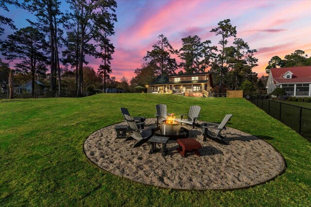 3550 Princess Pond Rd, Summerton, SC 29148 - yard at dusk with an outdoor fire pit