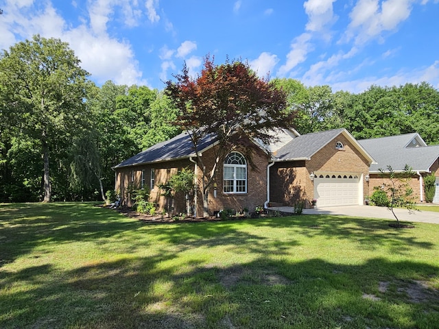 view of front of home featuring brick siding, an attached garage, concrete driveway, and a front yard