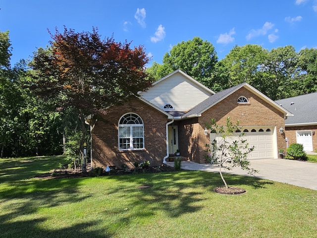 view of front of home with an attached garage, brick siding, driveway, and a front lawn