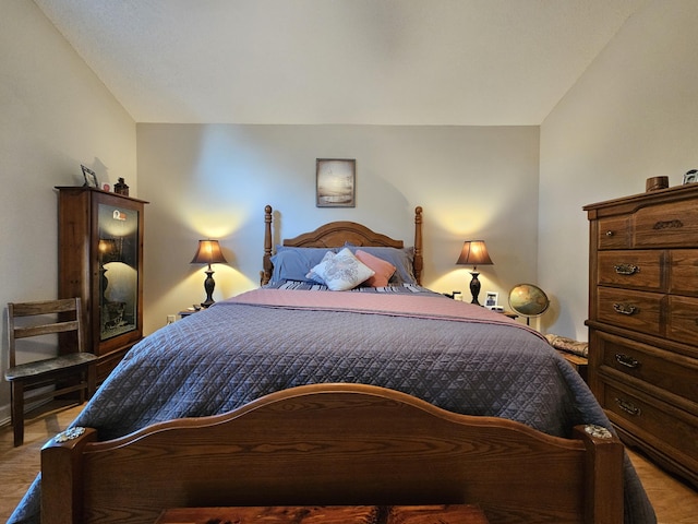 bedroom featuring wood finished floors