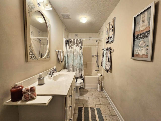 bathroom with a textured ceiling, baseboards, toilet, vanity, and shower / bath combo