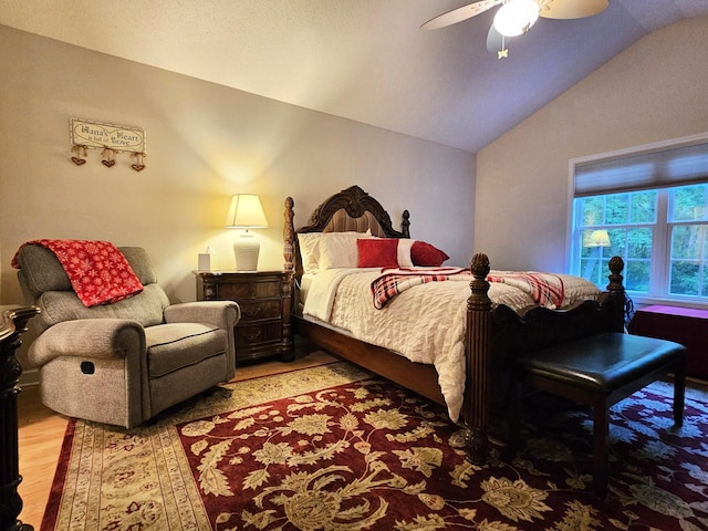 bedroom featuring vaulted ceiling, wood finished floors, and a ceiling fan