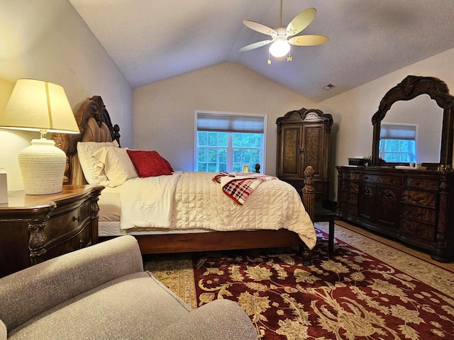 bedroom featuring vaulted ceiling and a ceiling fan