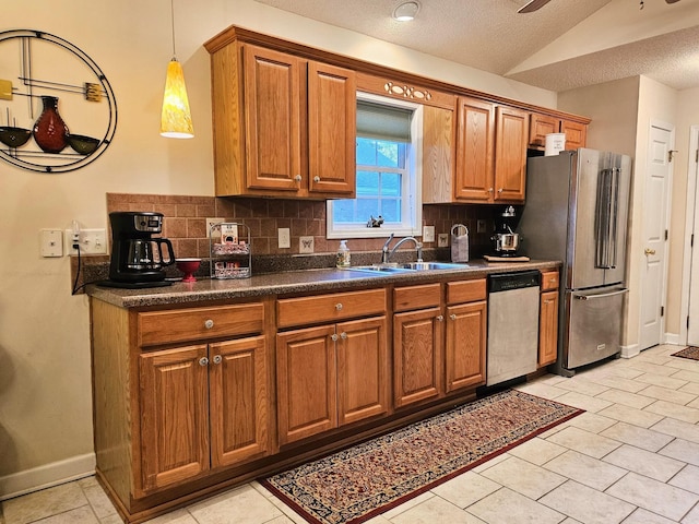 kitchen with stainless steel appliances, decorative backsplash, dark countertops, brown cabinetry, and vaulted ceiling