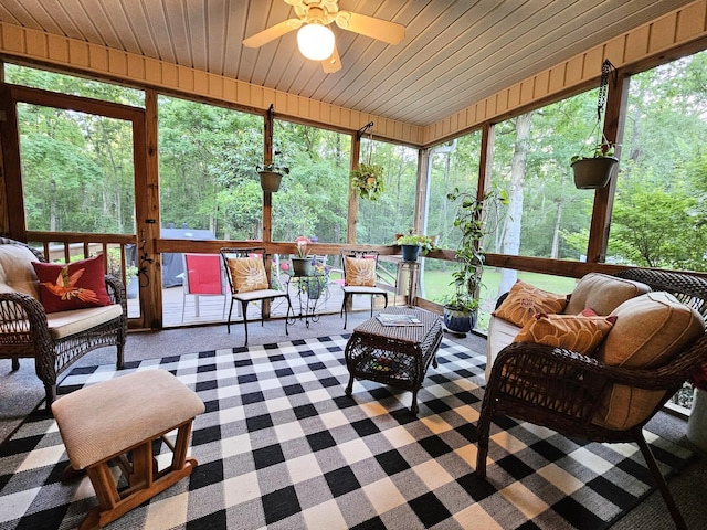 sunroom with a ceiling fan, outdoor lounge area, and plenty of natural light