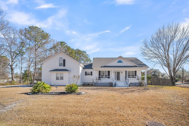 view of front facade with a front yard and covered porch