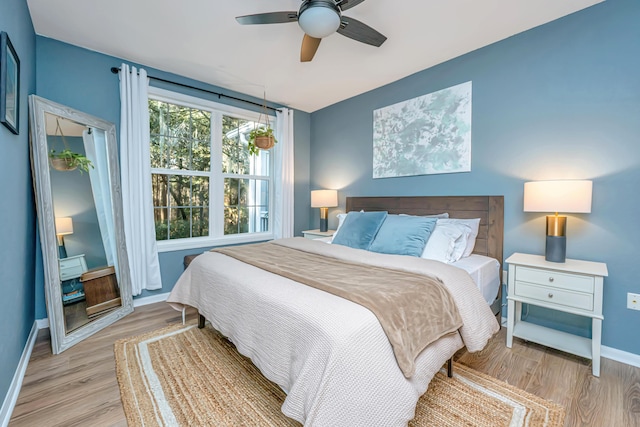 bedroom featuring ceiling fan and light wood-type flooring