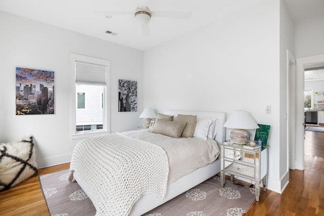 bedroom featuring wood-type flooring and ceiling fan