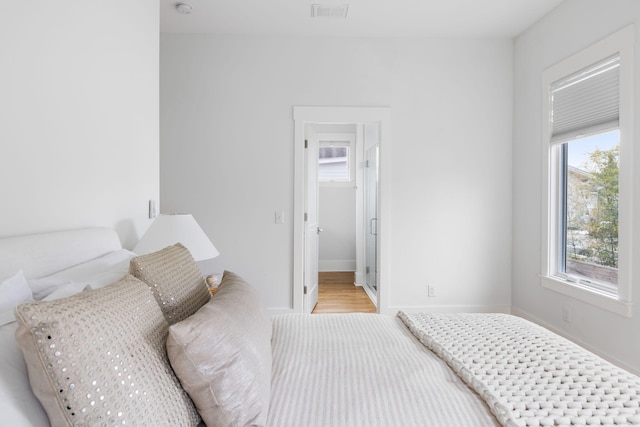 bedroom with light hardwood / wood-style floors