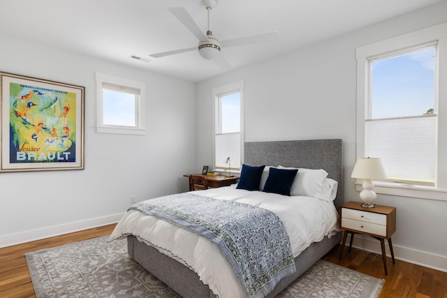 bedroom with hardwood / wood-style floors and ceiling fan