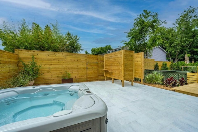 view of patio / terrace featuring a hot tub