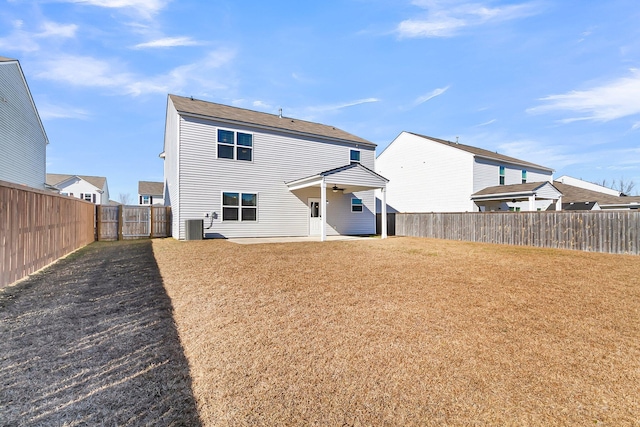 rear view of house with central AC