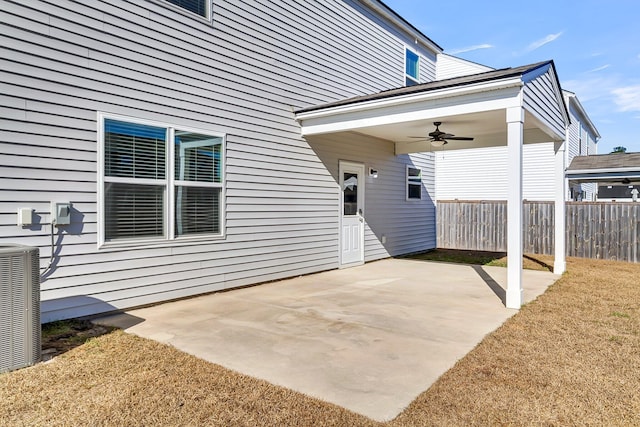 view of patio with central AC unit and ceiling fan