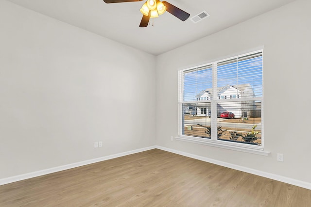 unfurnished room with ceiling fan and wood-type flooring