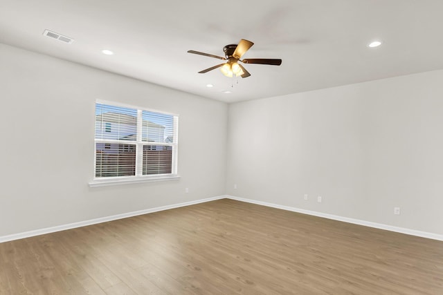 spare room featuring ceiling fan and wood-type flooring