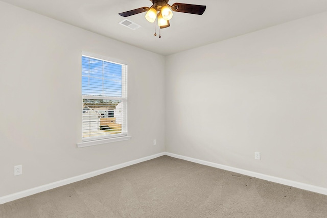 spare room with carpet flooring and ceiling fan