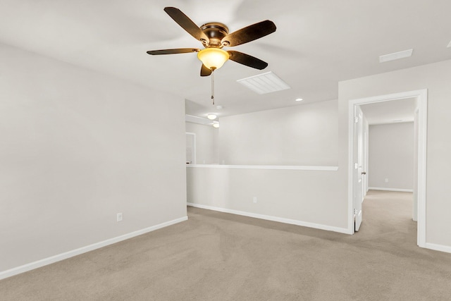 unfurnished room with ceiling fan and light colored carpet