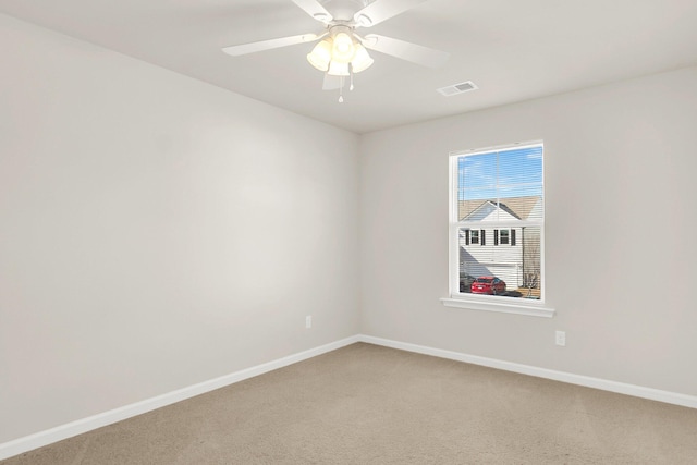 carpeted empty room with ceiling fan