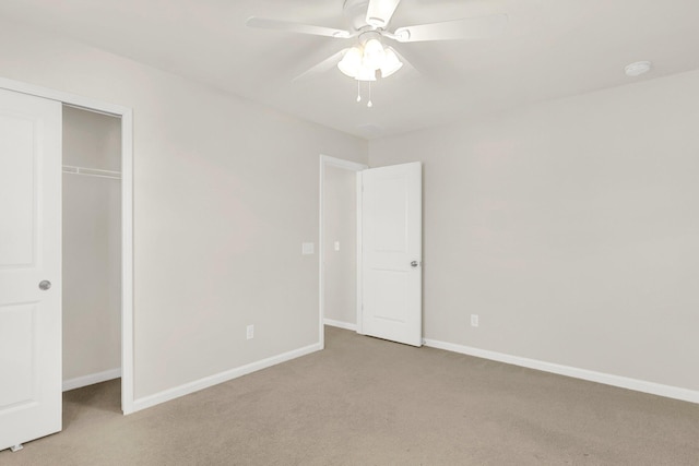 unfurnished bedroom with light carpet, a closet, and ceiling fan