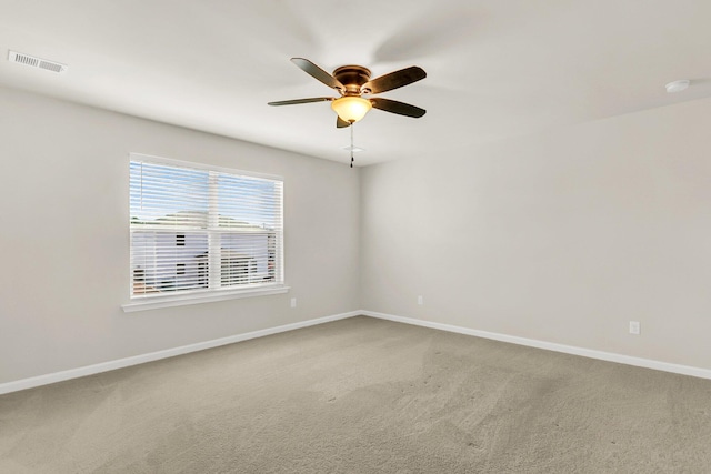 carpeted empty room with ceiling fan