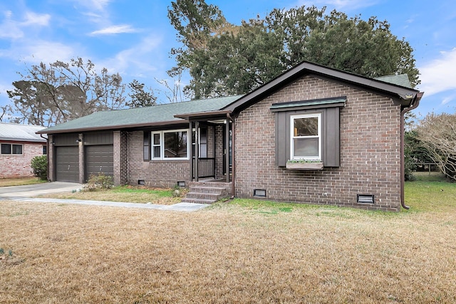 view of front of house featuring a garage and a front lawn