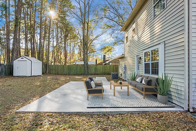 view of patio with cooling unit, an outdoor hangout area, and a shed